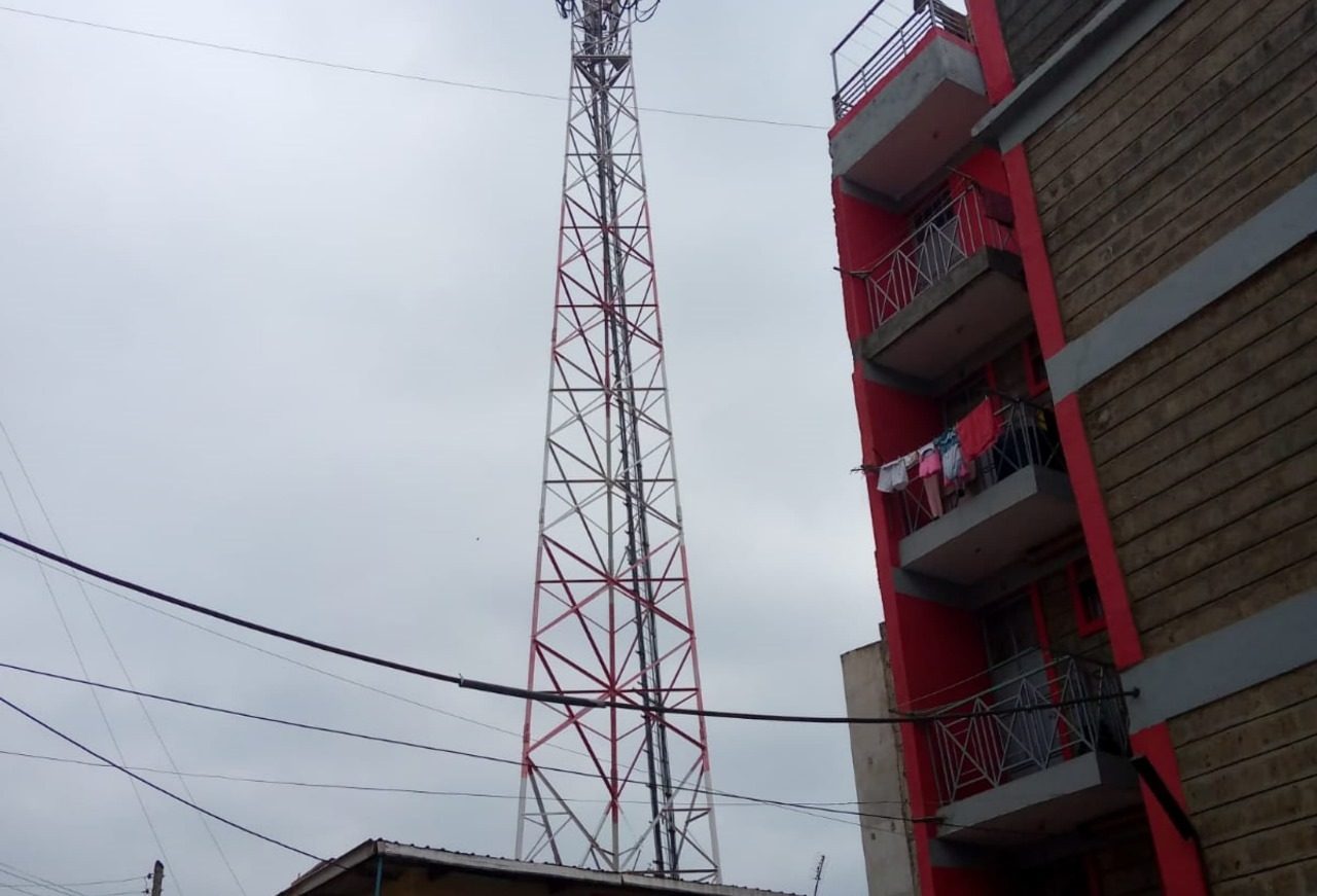 Electric cables, and a telecommunication network mast, city building